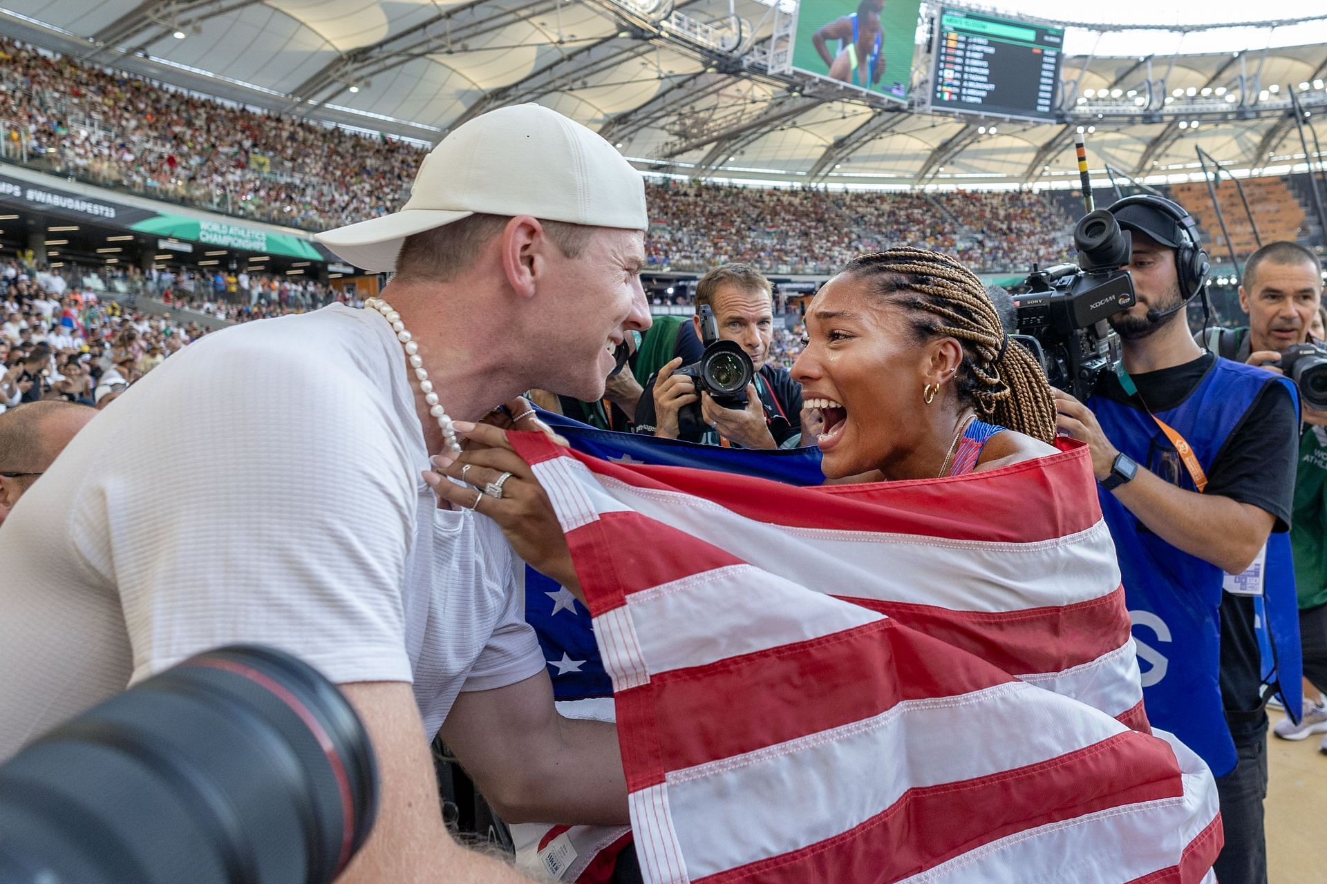 Tara Davis-Woodhall and husband Hunter Woodhall celebrate her silver win at World Athletics Championships 2023 (Photo via Getty Images)