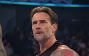 [PHOTO] CM Punk embraces 2 former Champions after SmackDown goes off the air