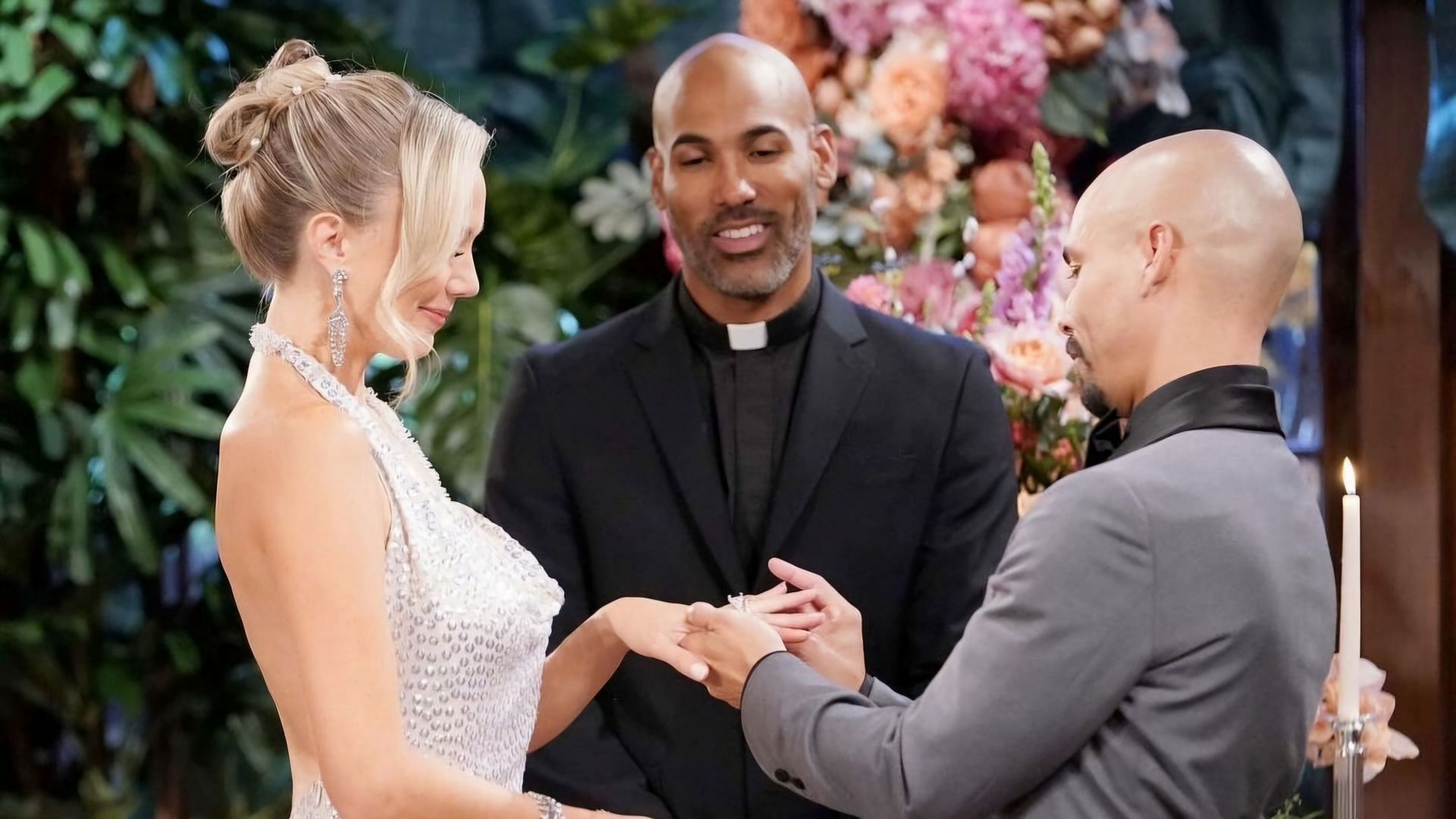 Reverend Holmes marrying Devon and Abby in a still from The Young and the Restless (via CBS)