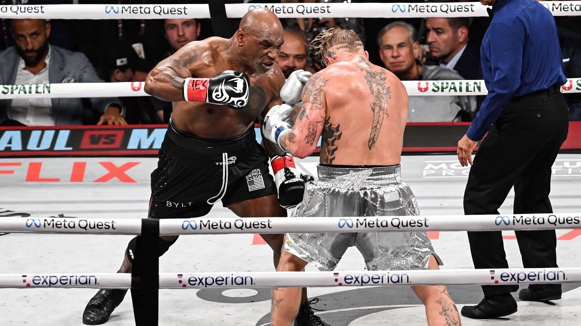 Mike Tyson (in black short) and Jake Paul (in silver short) exchange punches during their heavyweight world titles of the Premiere Boxing Championship on Friday night at AT&amp;T Stadium in Arlington, Texas, United States on November 15, 2024. (Photo by Tayfun Coskun/Anadolu via Getty Images)