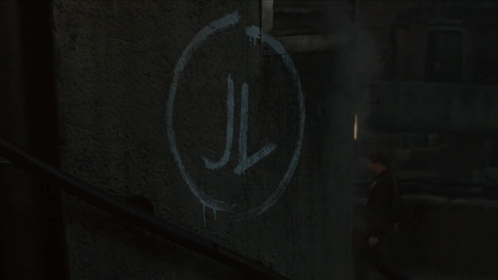 &#039;JL&#039; graffiti on the wall (Image via Apple TV+)