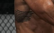 What does Michael Chandler's tattoo say?