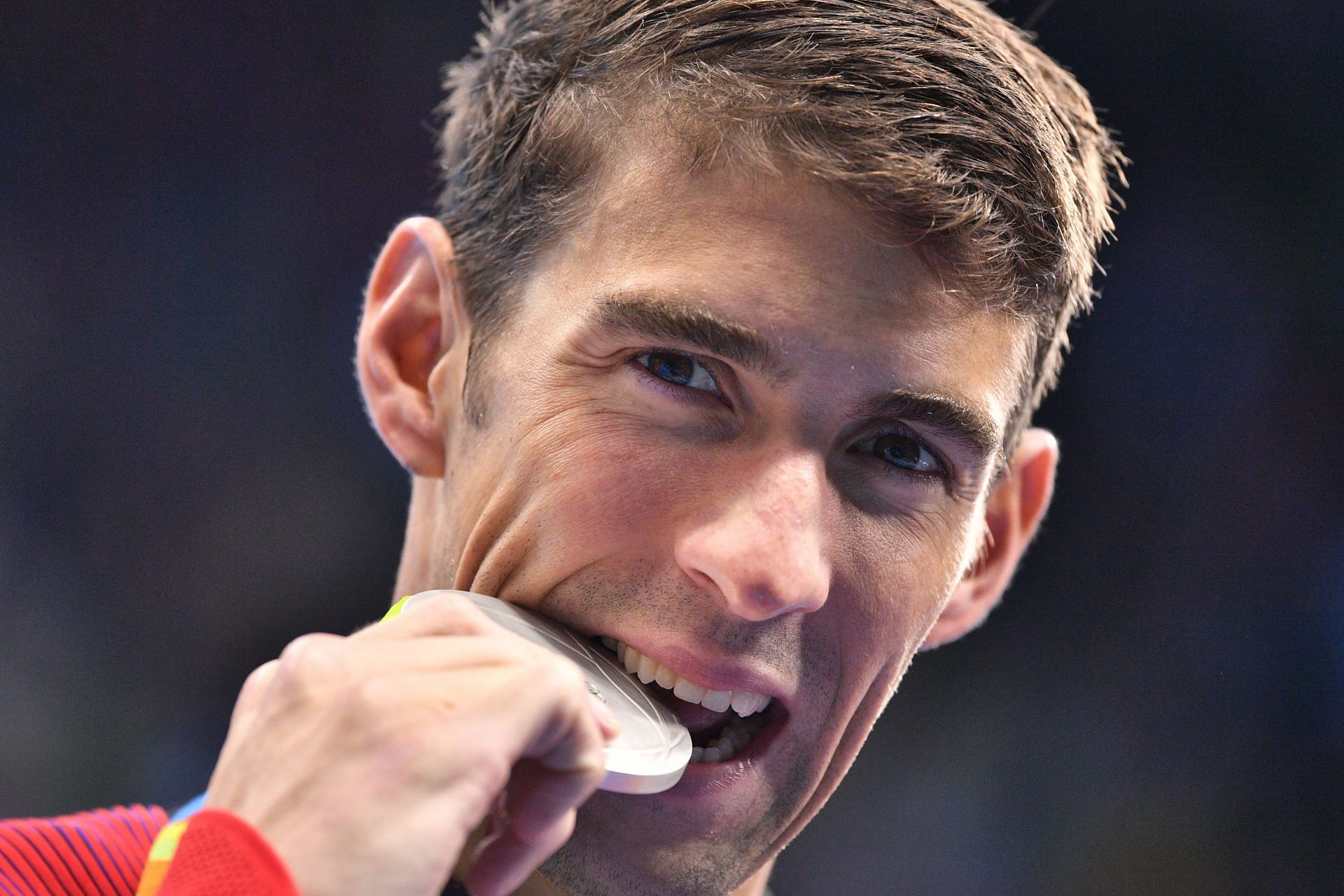 Phelps with his 100m Butterfly silver medal during the 2016 Rio Olympics (Image via: Getty)