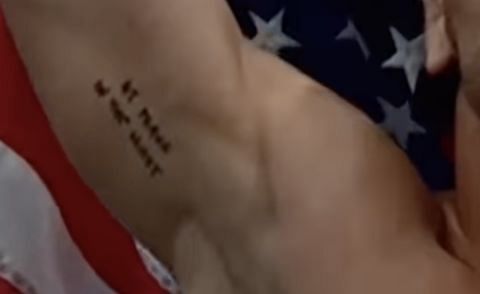 What does Michael Chandler&#039;s tattoo say?