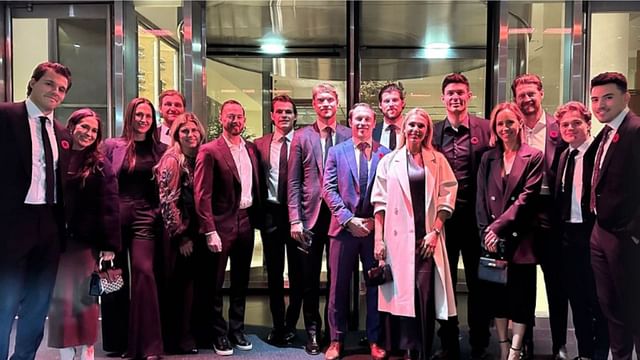 Carey Price and wife Angela poses for a picture with other Habs players. (Credit: IMAGN)