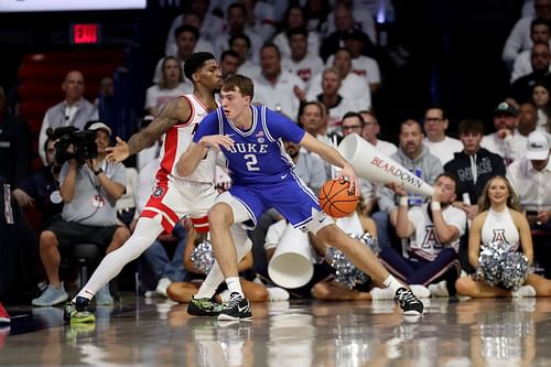 Cooper Flagg posting up Arizona's Caleb Love [COLLEGE BASKETBALL: NOV 22 Duke at Arizona - Source: Getty]