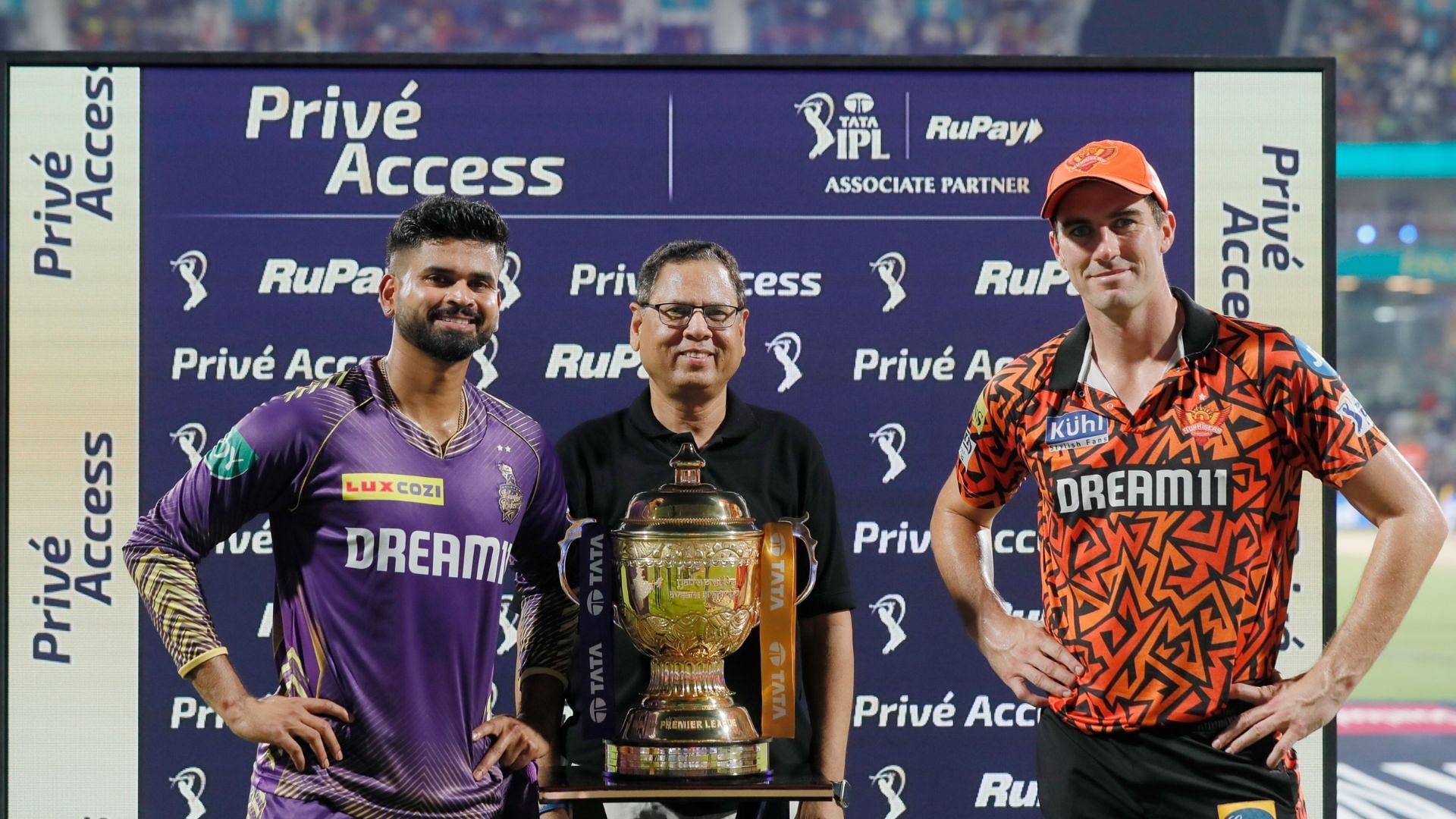 Shreyas Iyer (L) of Kolkata Knight Riders and Pat Cummins (R) of Sunrisers Hyderabad along with the IPL trophy [Image credits: @iplt20 on X]