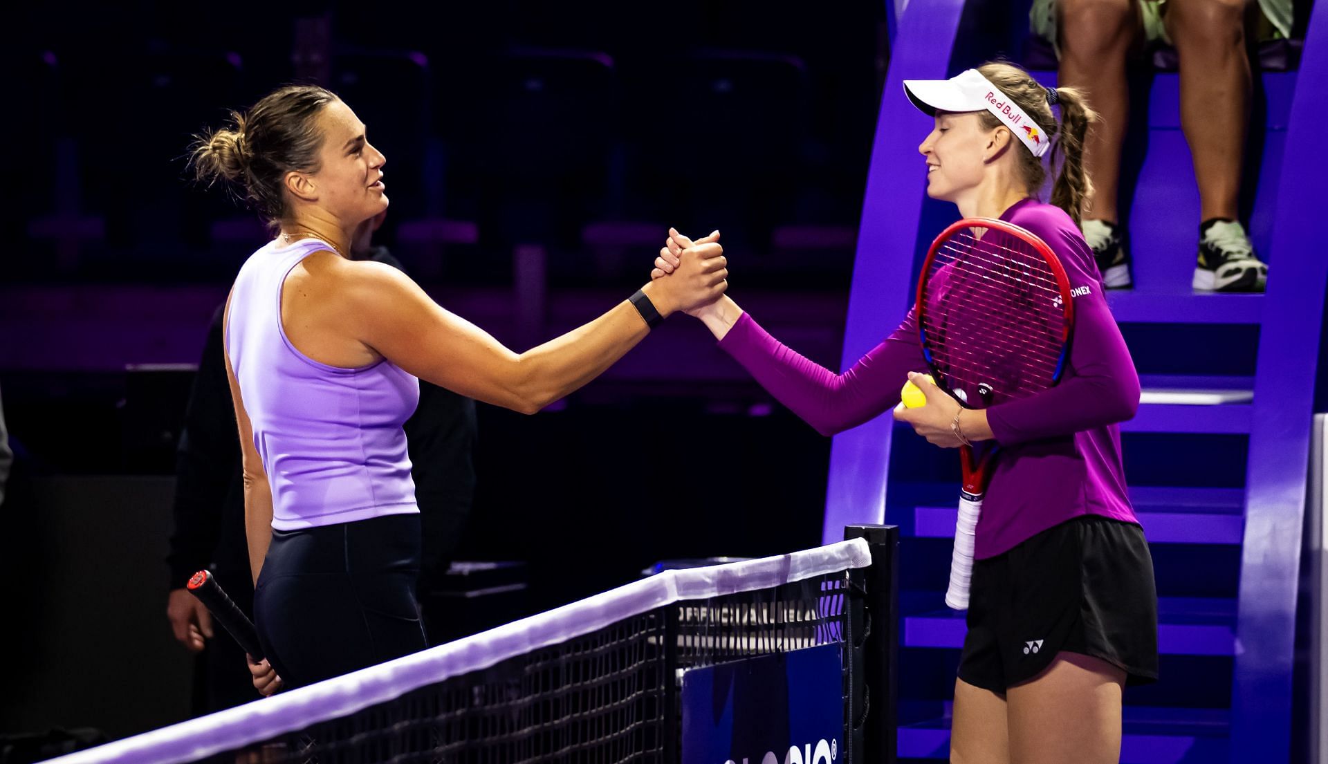 Elena Rybakina (R) and Aryna Sabalenka shaking hands after a practice session during the WTA Finals (Source: Getty Images)