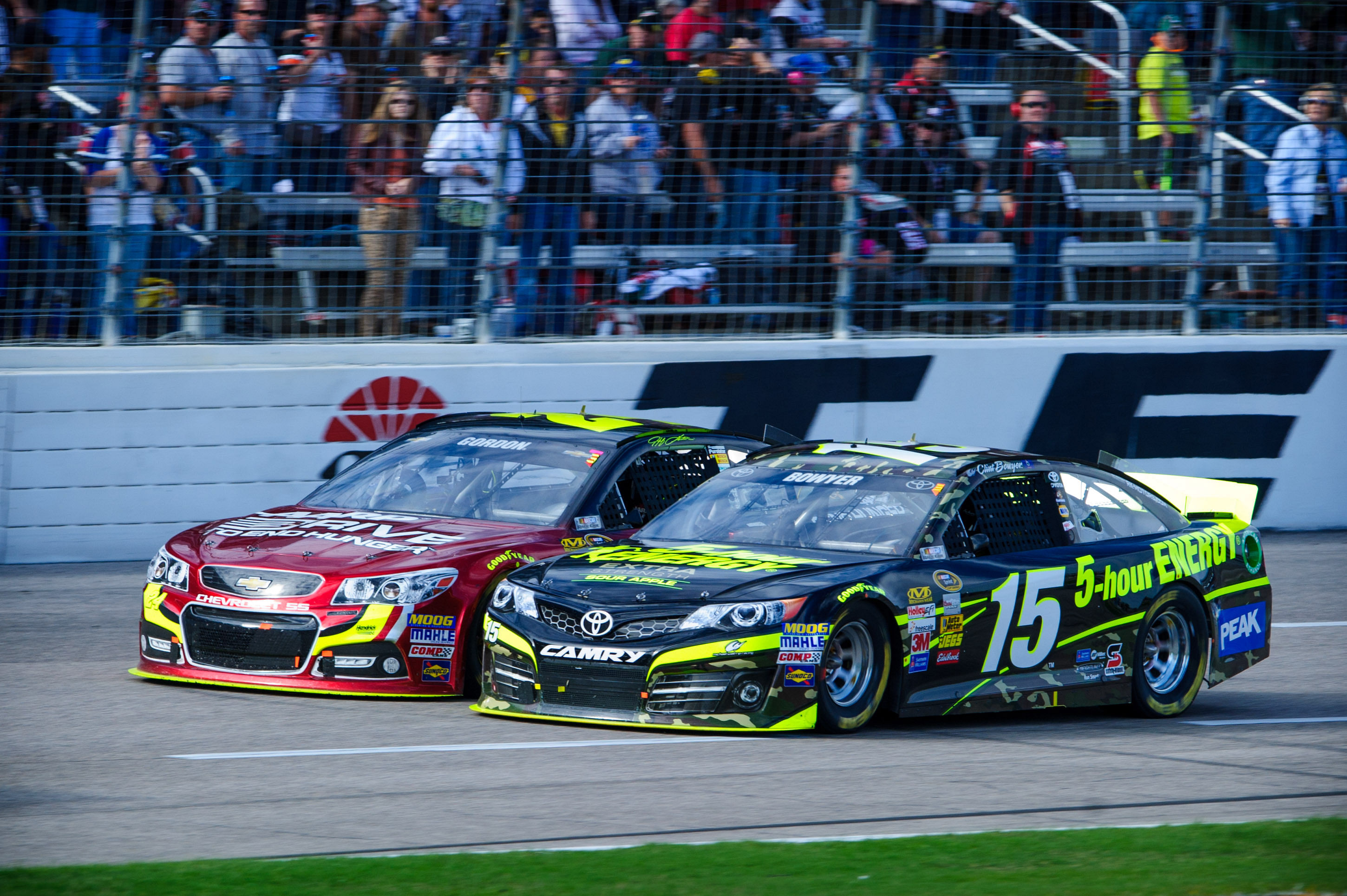 Sprint Cup Series driver Clint Bowyer (15) and driver Jeff Gordon (24) during the AAA Texas 500 race at Texas Motor Speedway. Mandatory Credit: Jerome Miron-Imagn Images