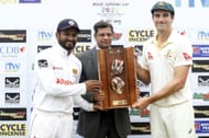 Pat Cummins and Dimuth Karunaratne with the Warne-Muralitharan Trophy. (Credits: SLC Twitter)