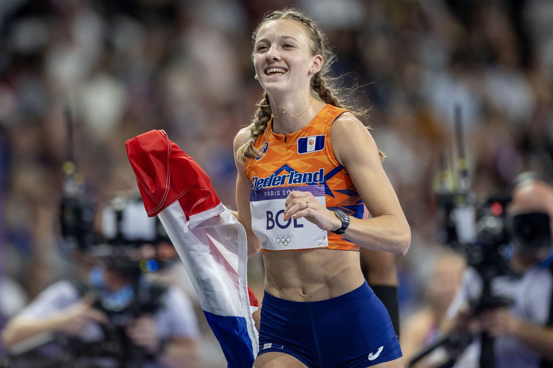 Femke Bol with the Dutch flag during the 2024 Summer Olympics in Paris (Image via: Getty Images)