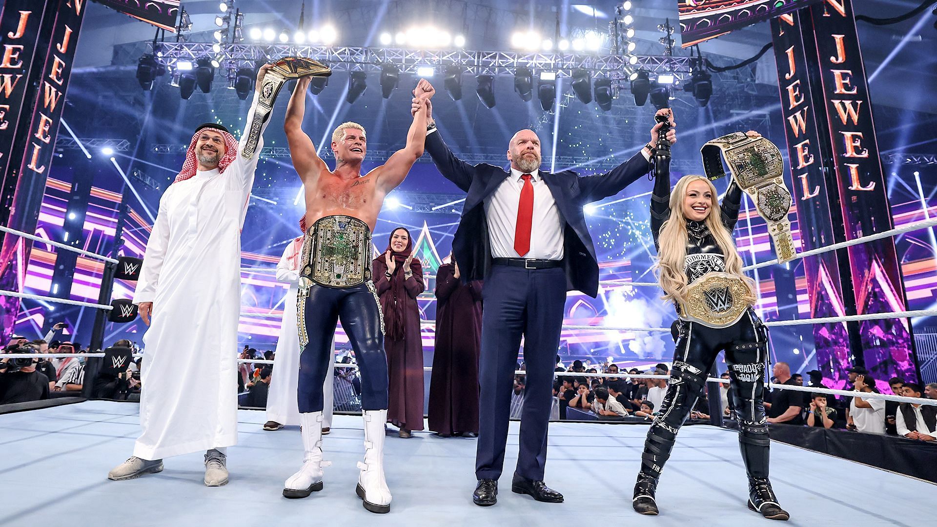 Triple H, Liv Morgan, and Cody Rhodes at WWE Crown Jewel
