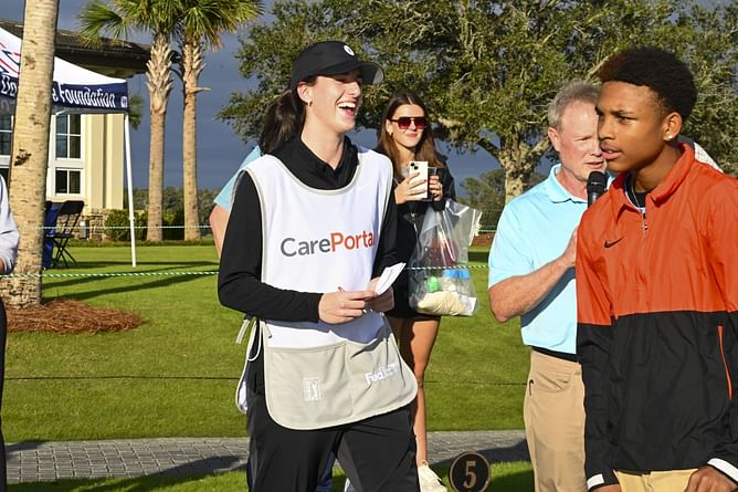 Watch: Caitlin Clark kneels in rain to sign fan's shoes during golf event, shouts out for sporting Kate Martin's gear