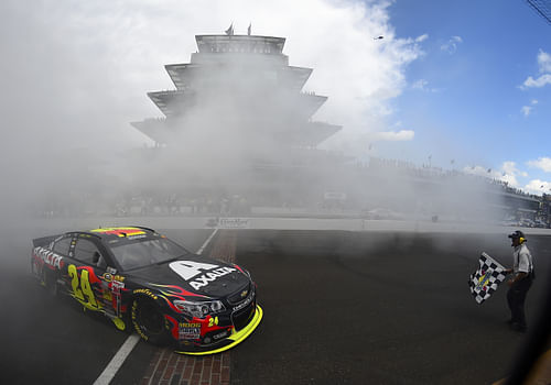 Jeff Gordon celebrating his fifth win at the Brickyard in the No. 24 Chevrolet in 2014 - Source: Imagn