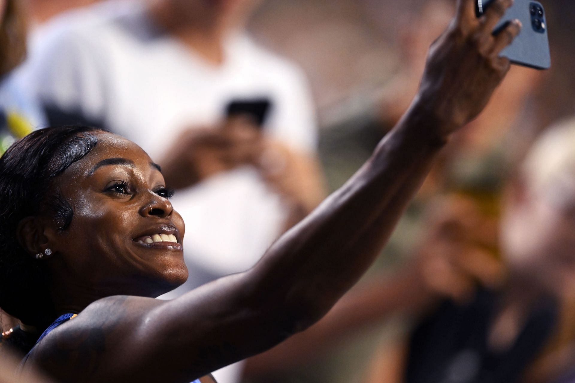 Elaine Thompson-Herah clicking selfies at the Allianz Memorial Van Damme 2023, part of the 2023 Diamond League series - (Source: Getty)