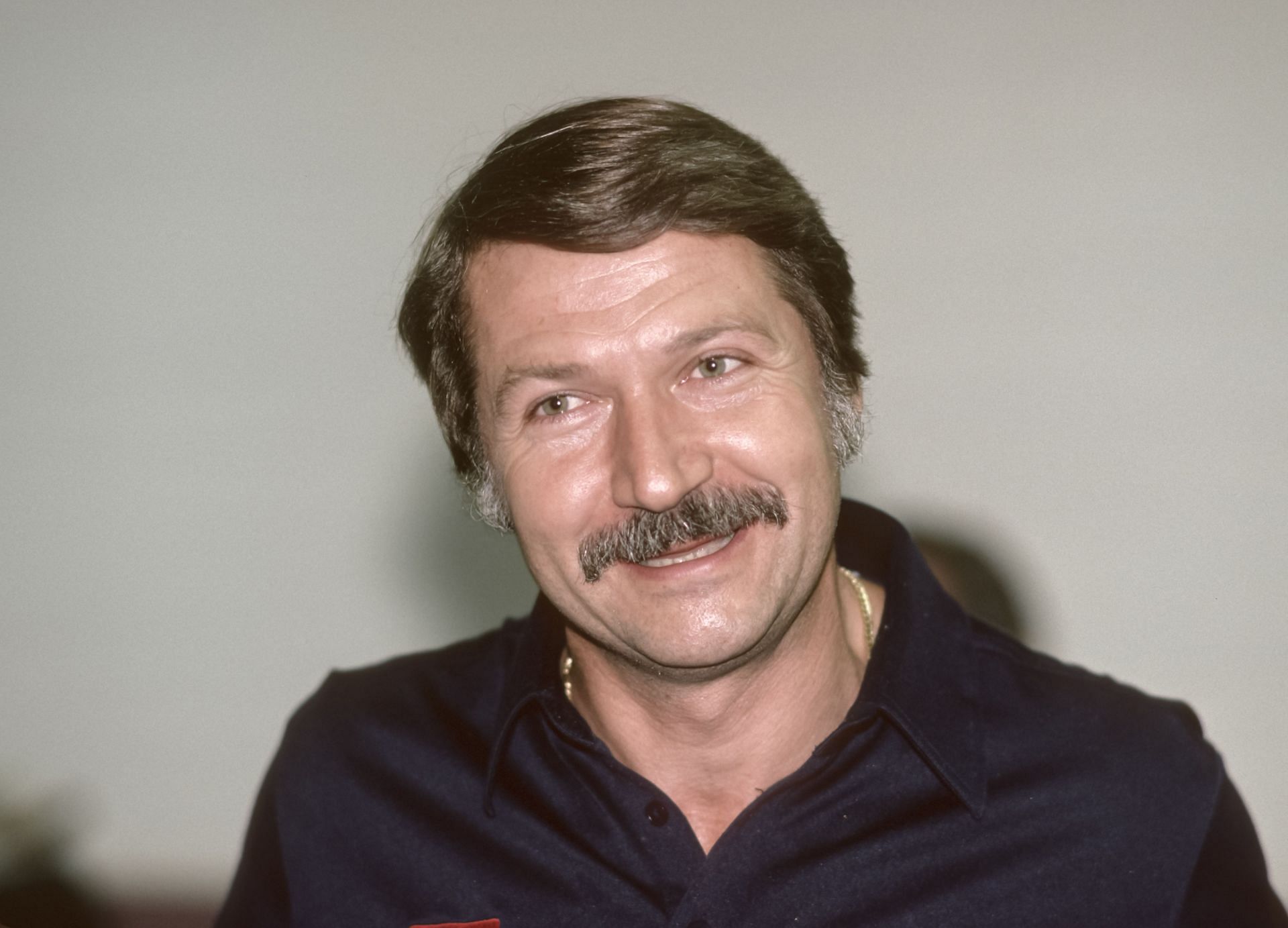 Coach Bela Karolyi of the USA speaks to the media during a USA - USSR gymnastics meet in 1988 in Phoenix, Arizona. (Photo by Getty Images)