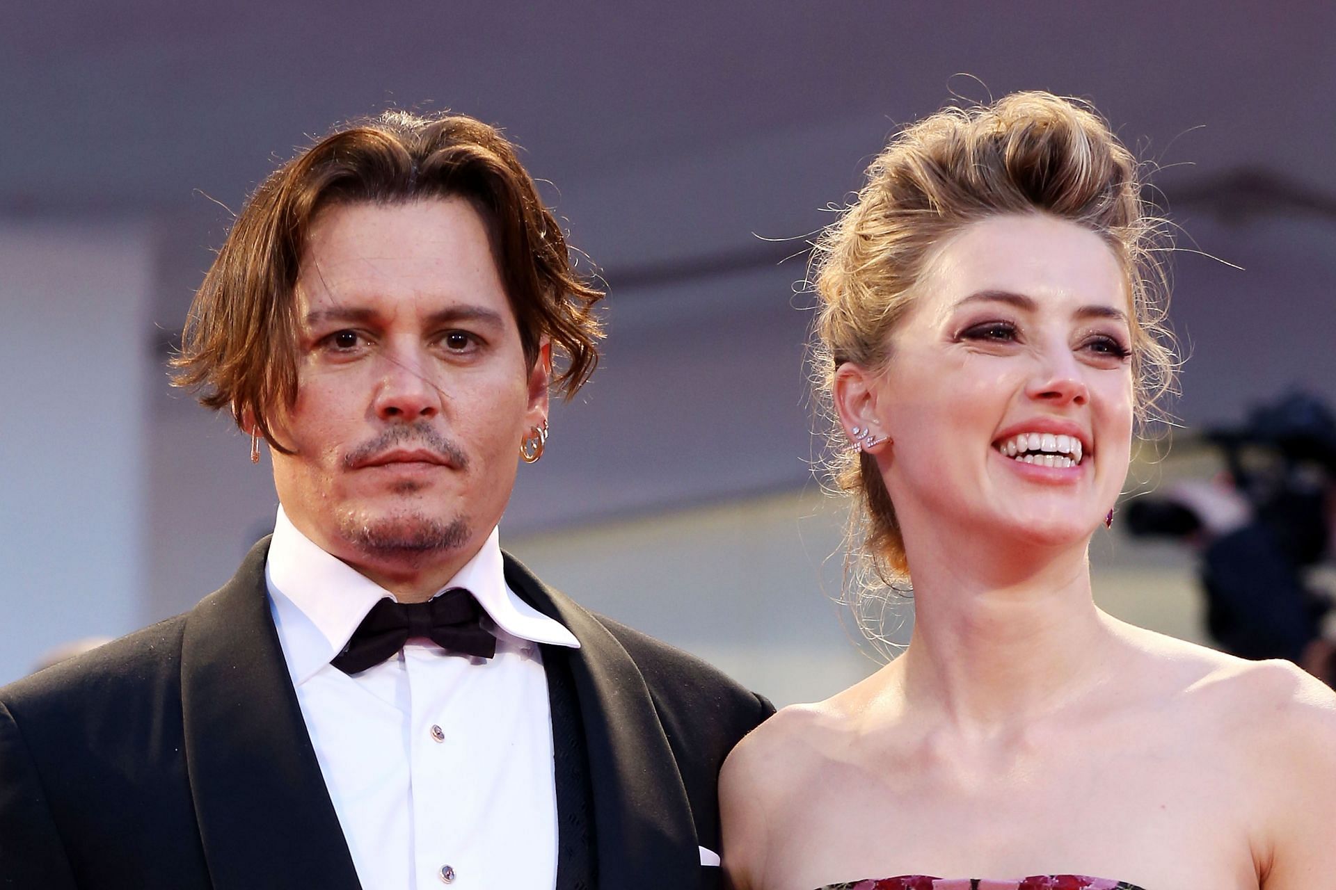 Johnny Depp and Amber Heard seen at the premiere of A Danish Girl (Image via Getty)