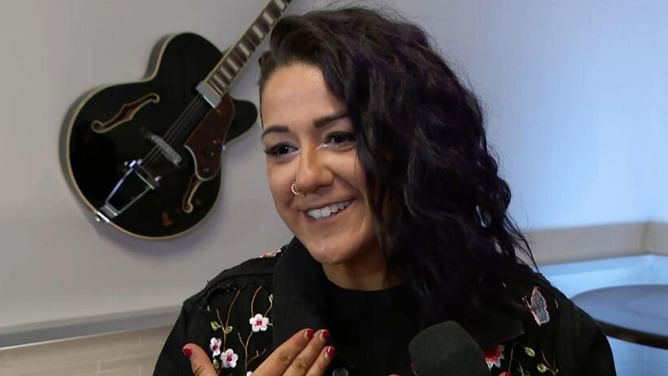 Bayley mocks Miss Money in the Bank after she’s handed a new WWE championship