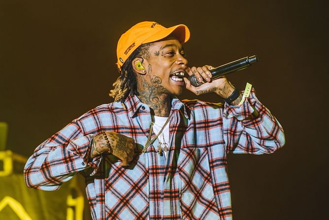 "Why was Wiz Khalifa on her podcast" — Internet reacts to Hawk Tuah girl Hailey Welch receiving custom weed package from the rapper
