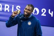Noah Lyles, of the United States celebrates on the podium during a ceremony for the men's 100-meter final at the 2024 Summer Olympics in Paris, France. (Photo via Getty Images)