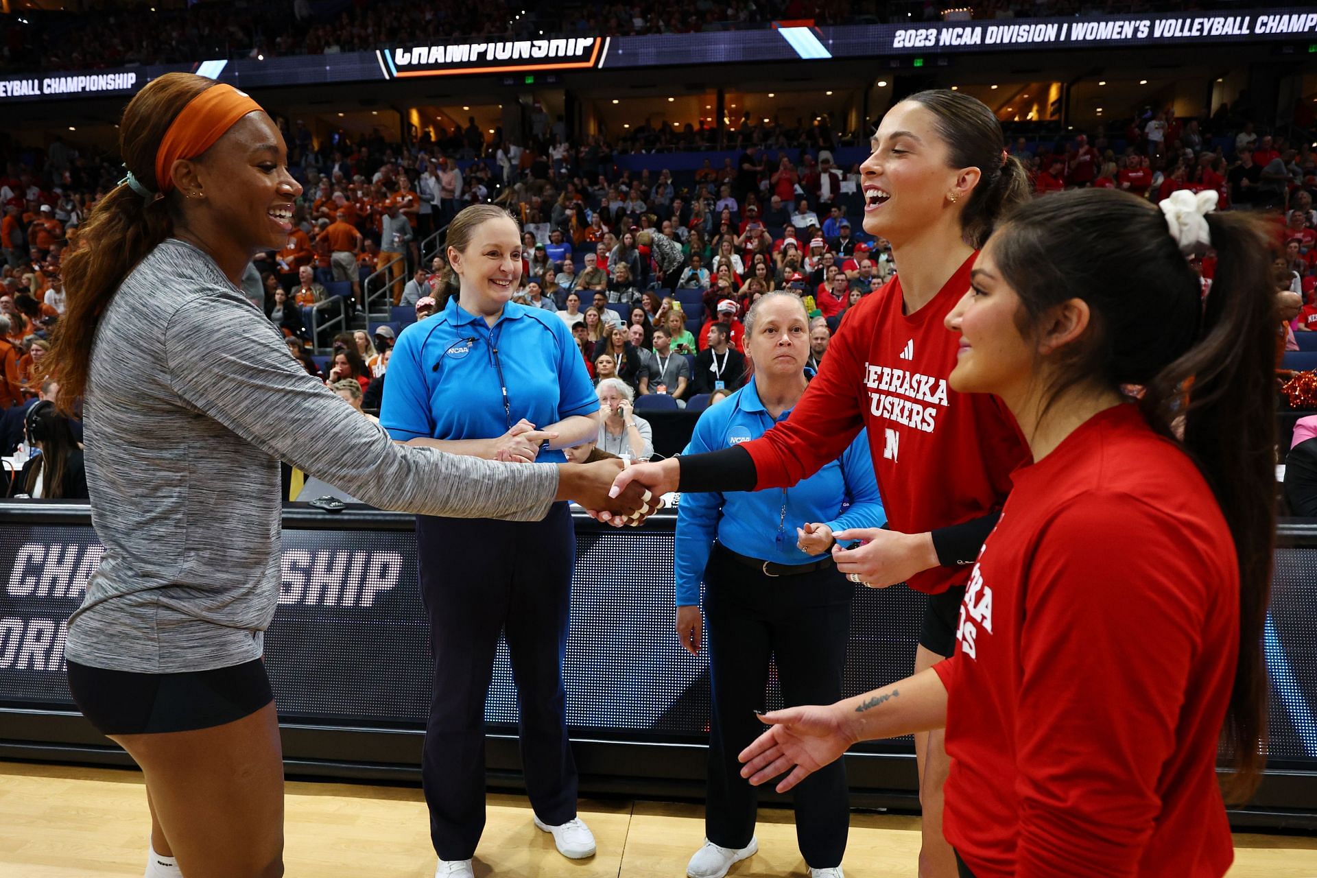 Merritt Beason (right) with a Texas Longhorns player during the 2023 NCAA Women&#039;s Volleyball Championships (Image via: Getty Images)