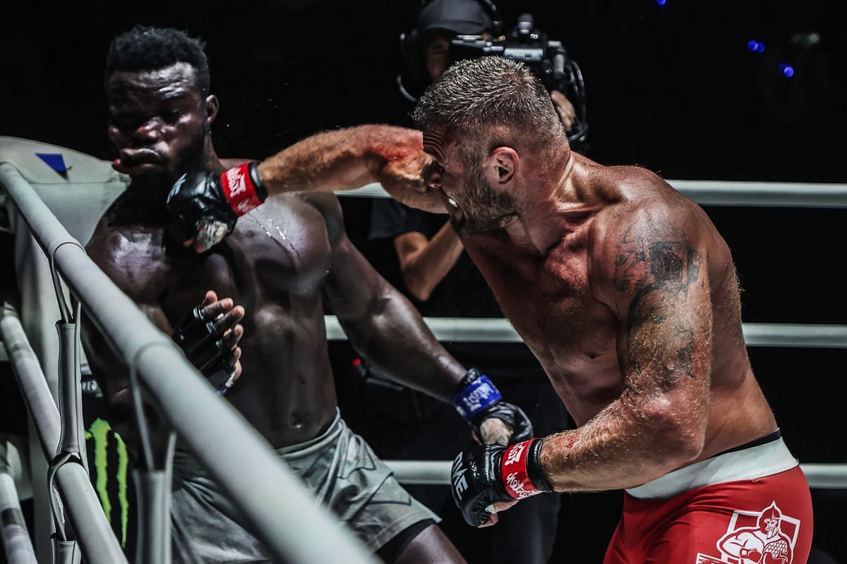 Anatoly Malykhin (R) lands a punch against Reug Reug (L)  | Image by ONE Championship