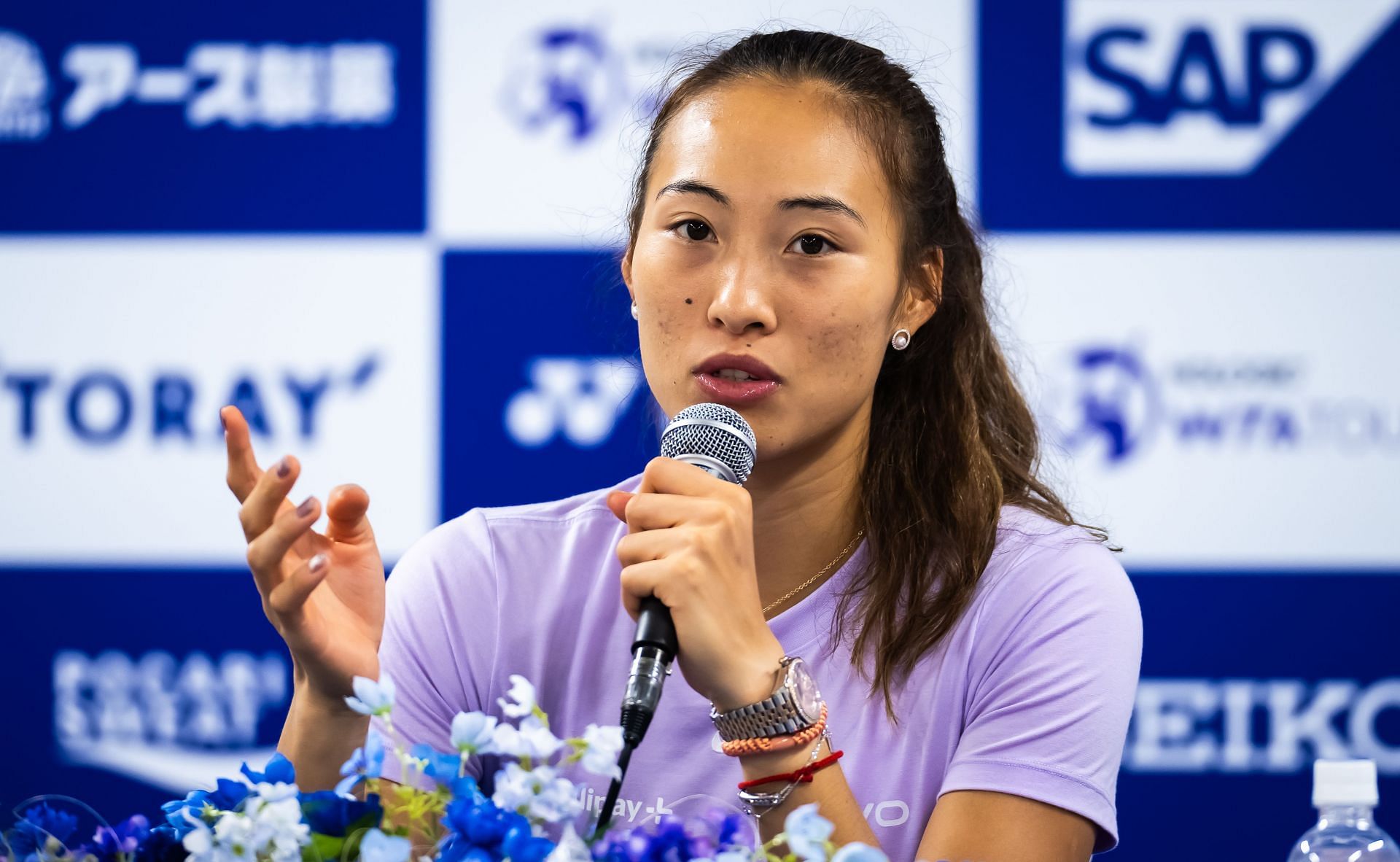 Zheng Qinwen speaking at a press conference [Source: Getty]