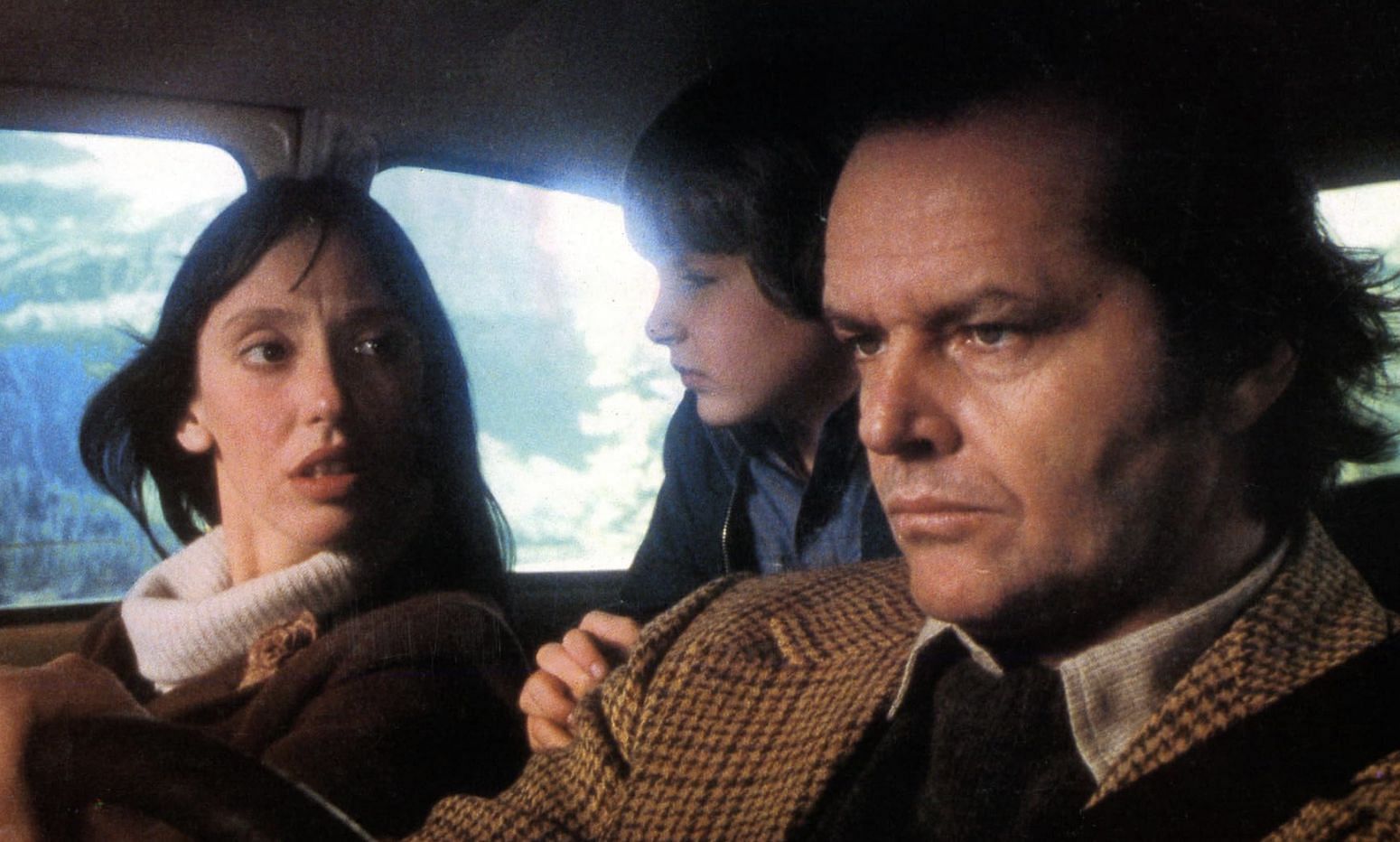 Jack Nicholson, Shelley Duvall, and Danny Lloyd in The Shining (Image via Warner Bros.)