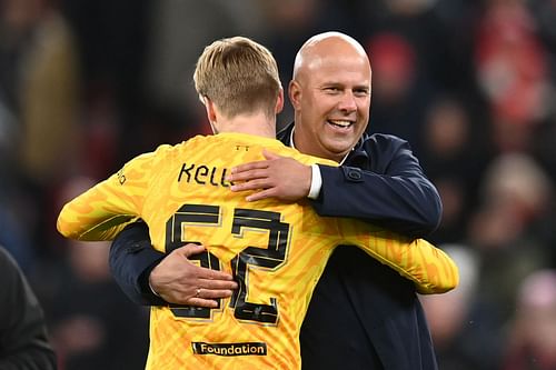 Caoimhin Kelleher celebrates with Arne Slot after Liverpool's win (Image - Getty)