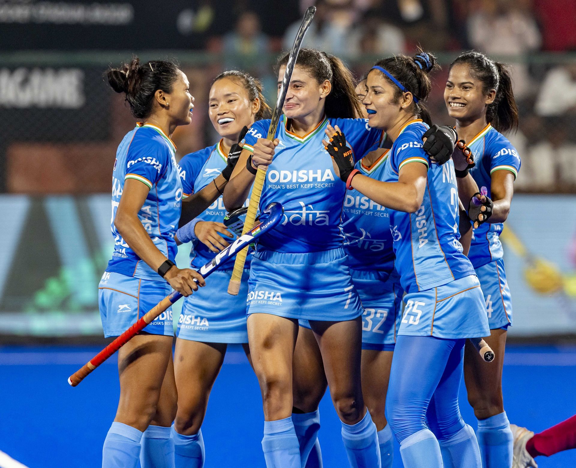 Indian players, including Navneet Kaur, celebrate her goal.