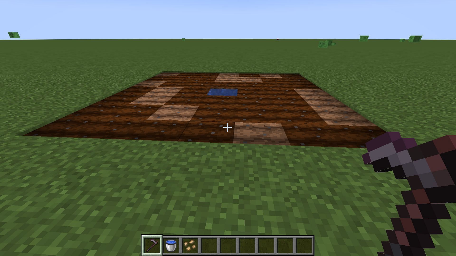 A basic farm needs to be plowed before you can automate it (Image via Mojang Studios)