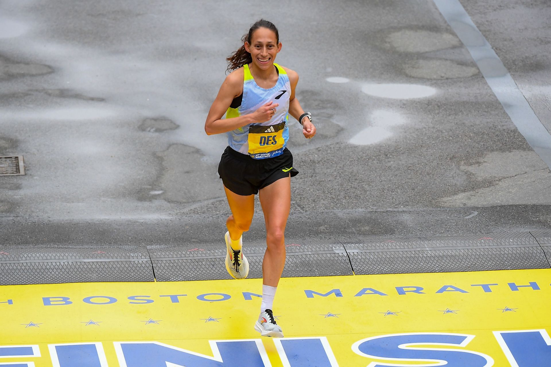 Linden crossing the finishing line at the 127th Boston Marathon (Image via: Getty Images0