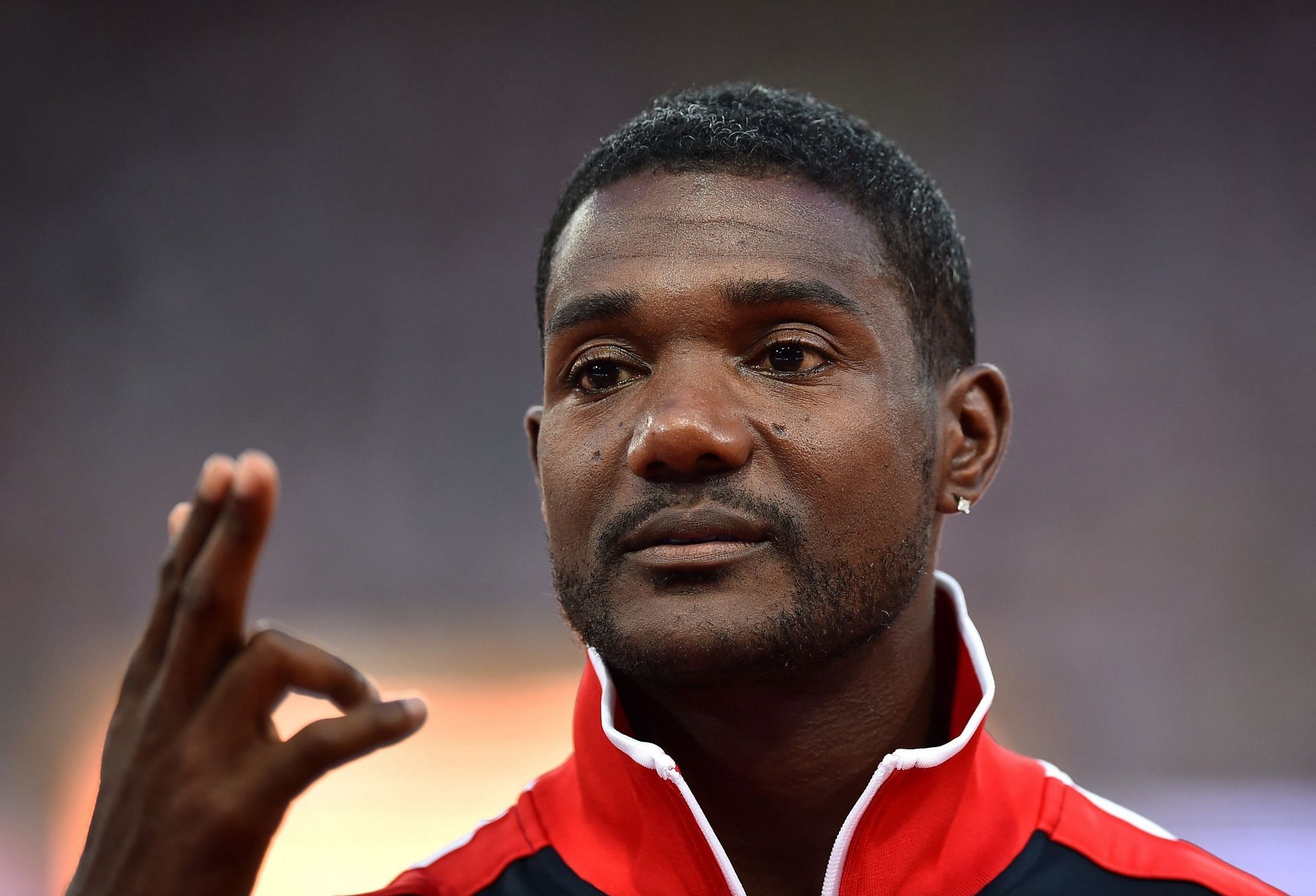 Justin Gatlin in a red and black dress at the 15th IAAF World Athletics Championships in Beijing 2015 (Image via: Getty)