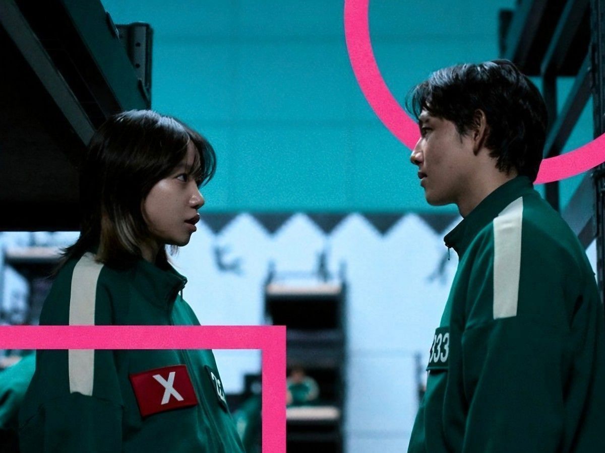 Jo Yu-ri wearing a red X badge in the released stills from Netflix (Image via Instagram/@netflixkcontent)