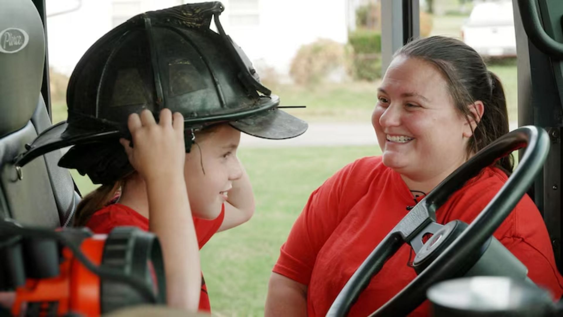 In an Evansville Fire Department truck honoring Griffin&#039;s father, Robert Doerr, Lindsey Griffin sits with her daughter (Image via ABC News)