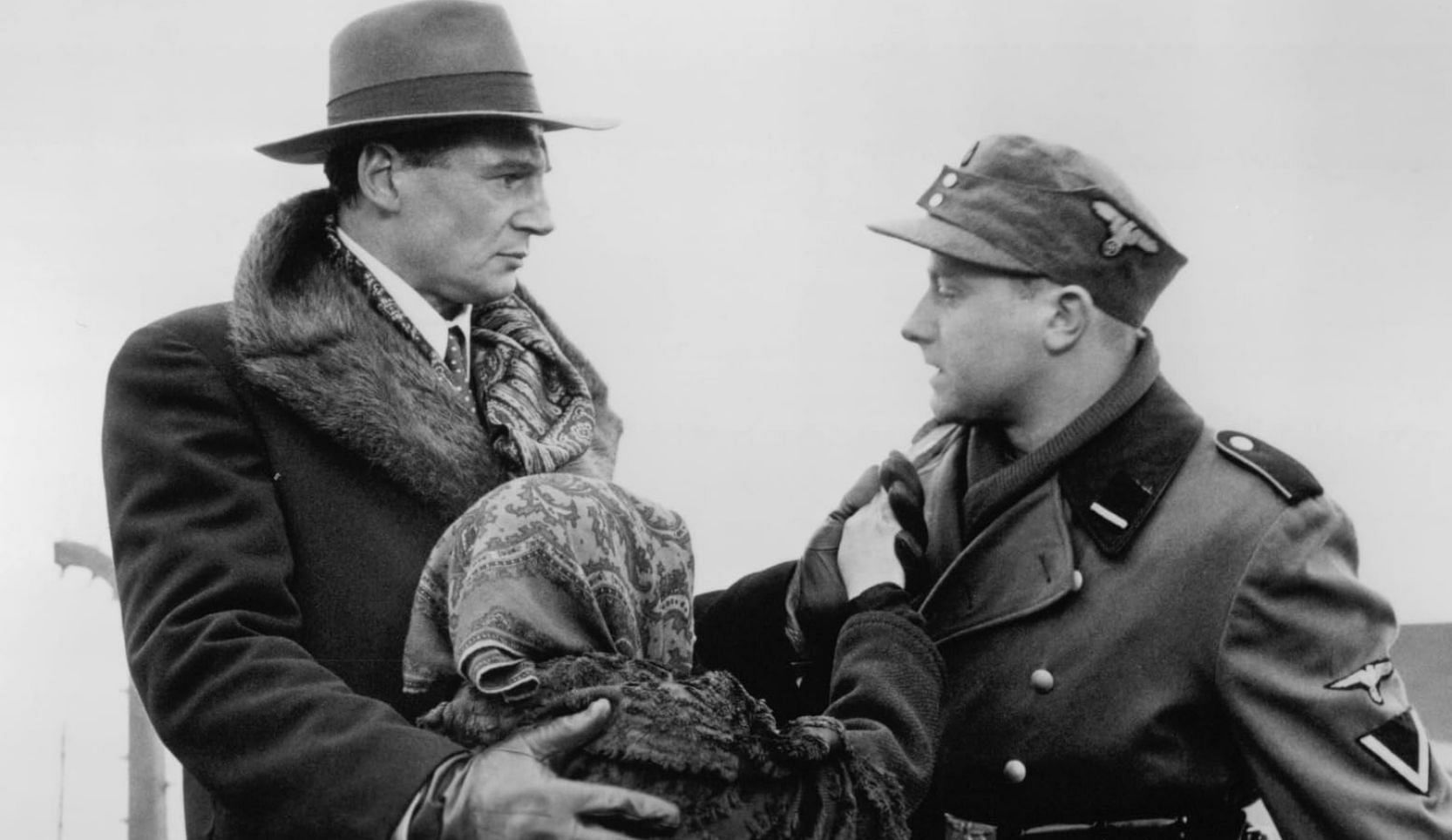 Liam Neeson, Olaf Lubaszenko, and Anna Mucha in Schindler's List (Image via Universal Pictures)