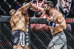 WATCH: Iranian juggernaut Amir Aliakbari flaunts his power and sneaky athleticism against former champ Arjan Bhullar in Qatar