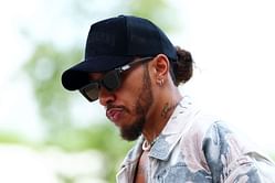 Lewis Hamilton turns heads in abstract-patterned jacket paired with all-white ensemble arriving at Qatar paddock