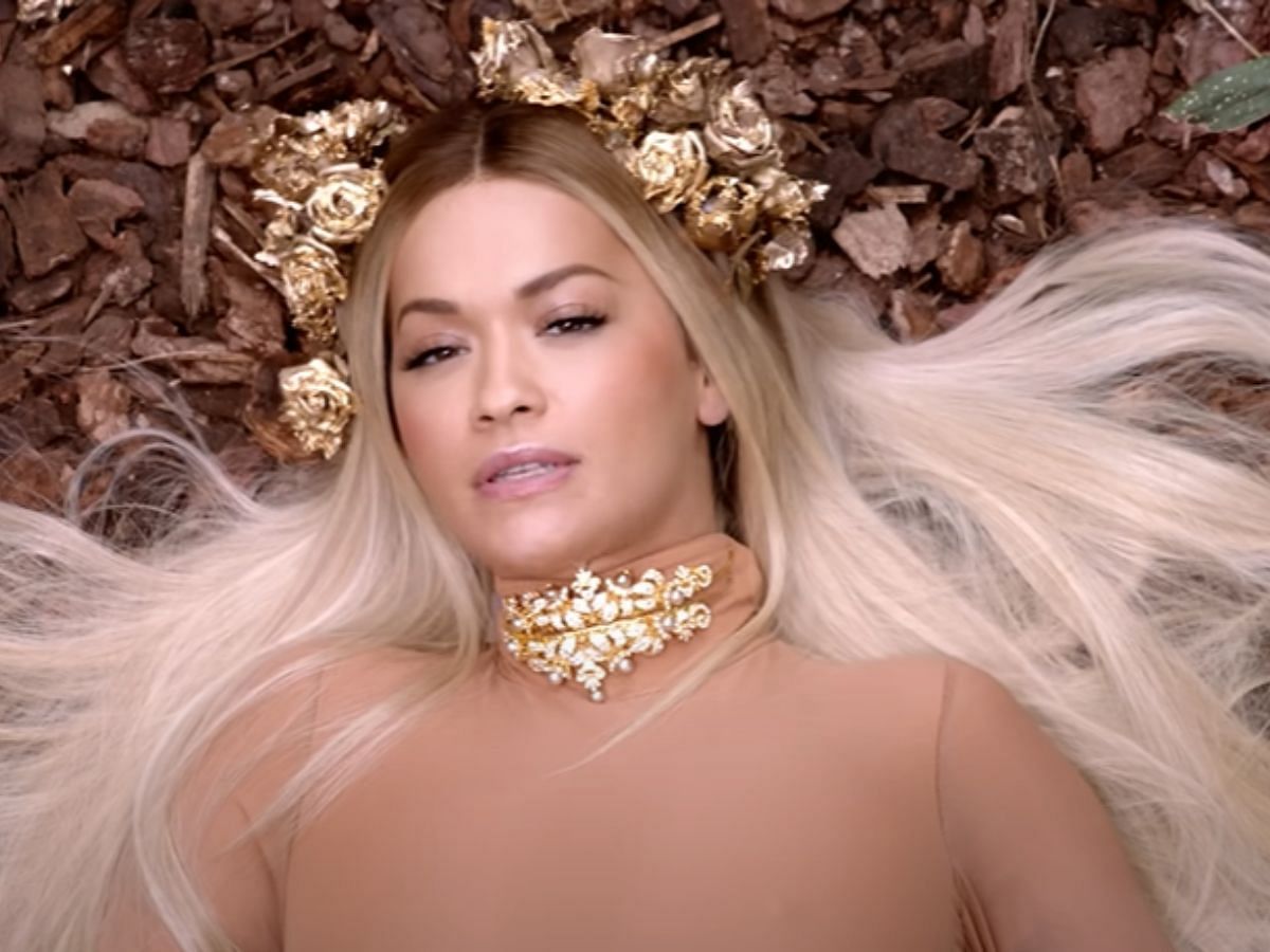 The rap song, which explores themes of female empowerment, self-love, and bisexuality, was criticized upon its release. Cardi B&rsquo;s lines above and Rita Ora&rsquo;s chorus resulted in backlash as pop artist Hayley Kiyoko, on May 11, 2024, described the lyrics as tone-deaf (Image via YouTube/ Rita Ora