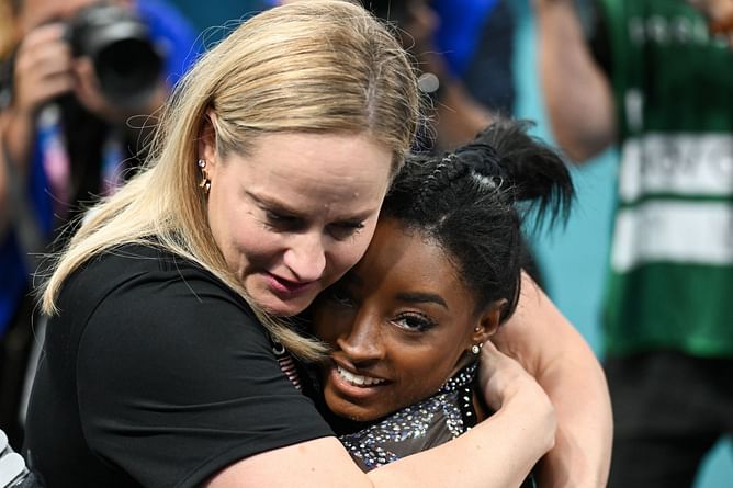 Simone Biles' former coach Cecile Landi reacts to her daughter's performance at the World Aquatics Junior Diving Championships