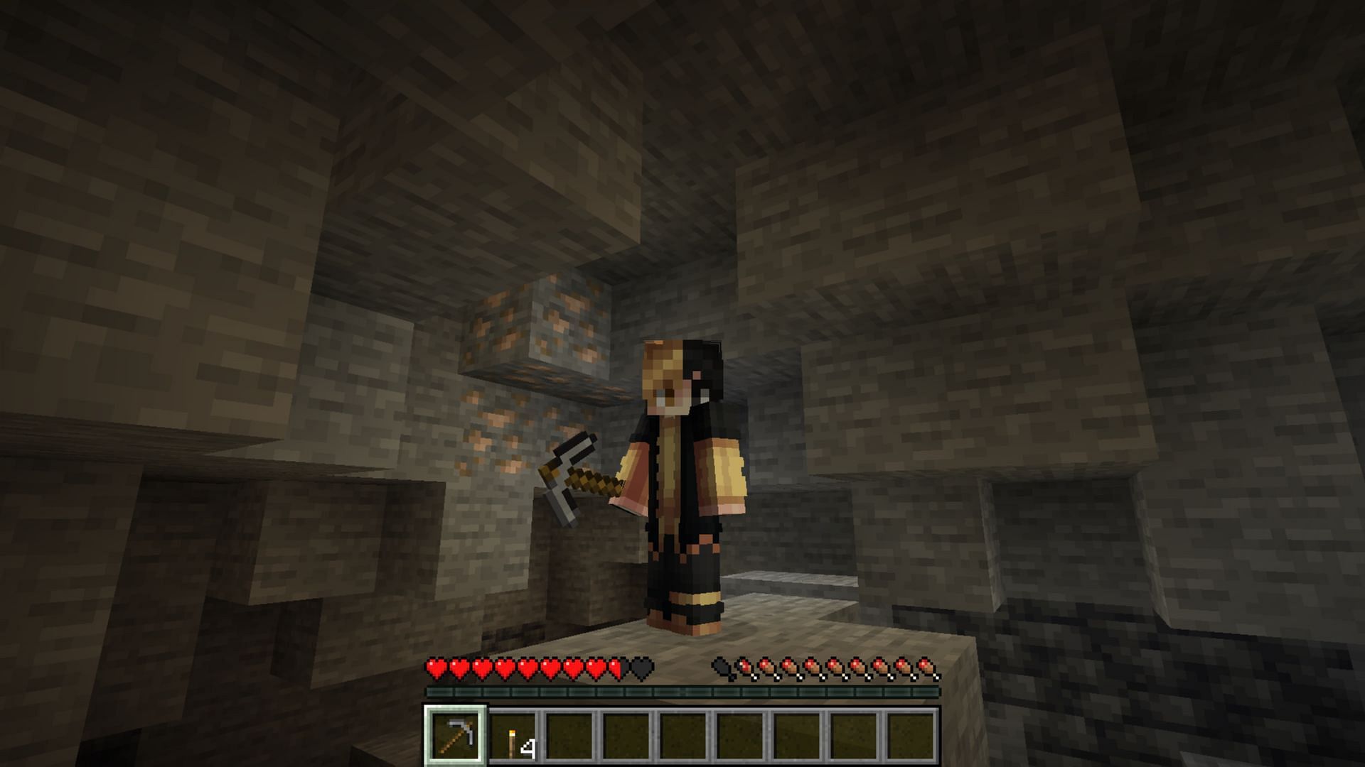 Use your pickaxe or explosives to mine iron in Minecraft Bedrock edition (Image via Mojang Studios)