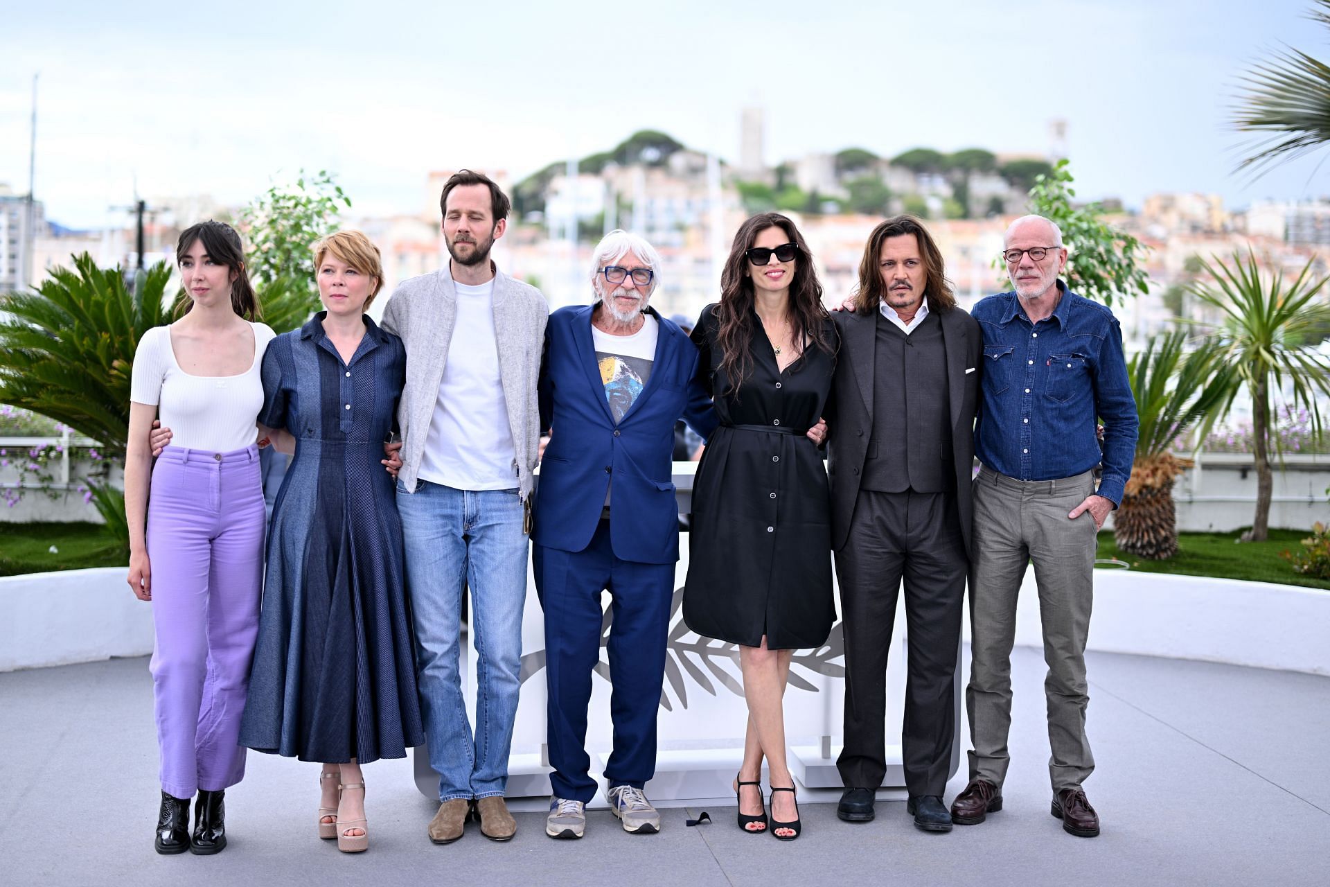 Johnny Depp seen with the cast of Jeanne du Barry at the photocall in 2023 (Image via Getty)