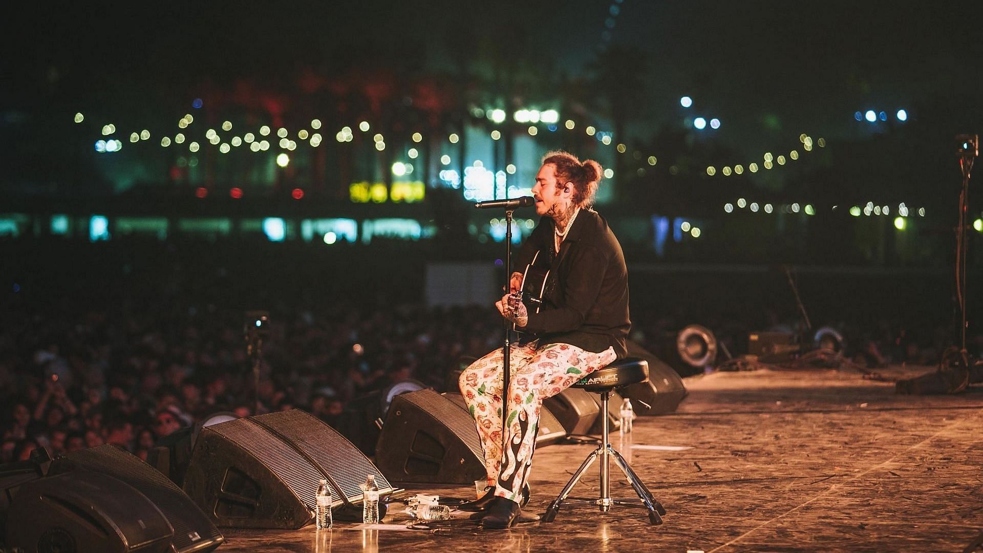 Post Malone performs onstage during 2018 Coachella Valley Music And Arts Festival Weekend 1 at the Empire Polo Field on April 14, 2018, in Indio, California. (Image via Getty Images/Natt Lim)