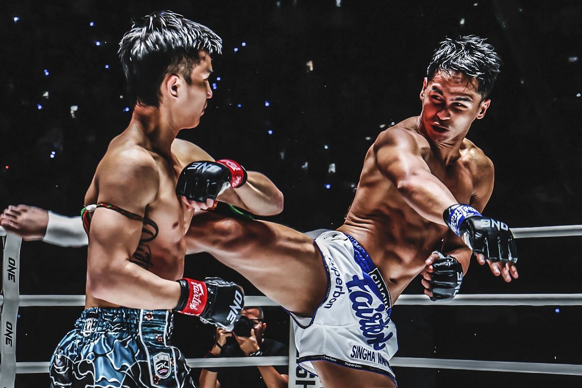 Superbon lands a kick against Tawanchai in their first match. [Photo from ONE Championship]