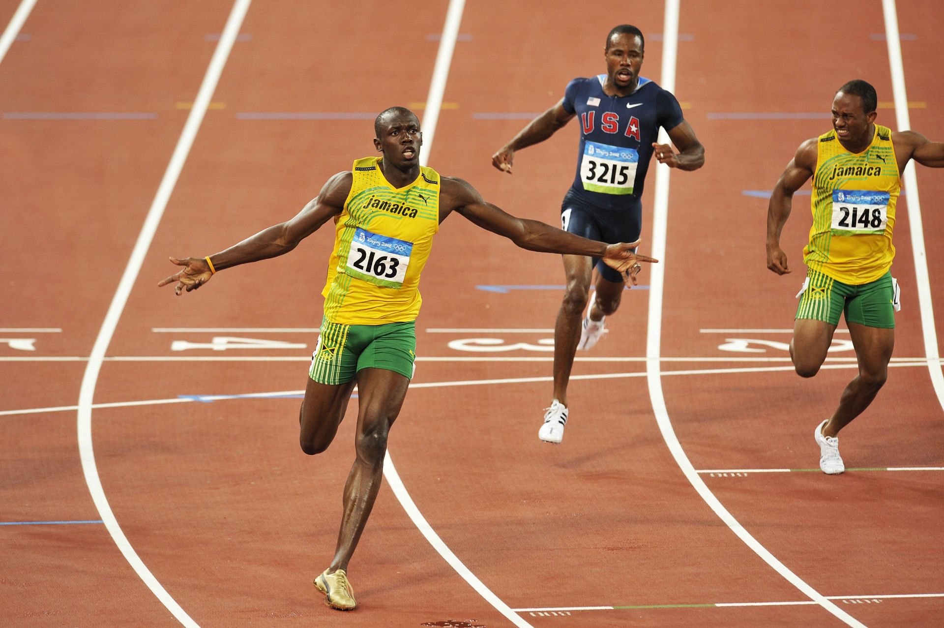 Usain Bolt celebrating as he races the way to the world record in the 100m finals at Beijing Olympics 2008 [Image Source : Getty]