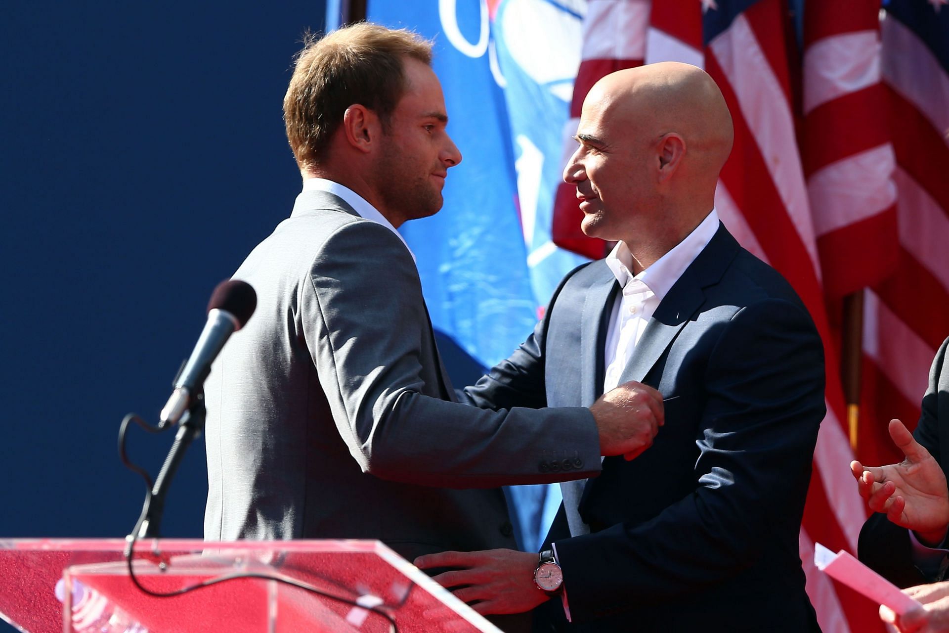 Andy Roddick (L) and Andre Agassi at the 2012 US Open (Image: Getty)