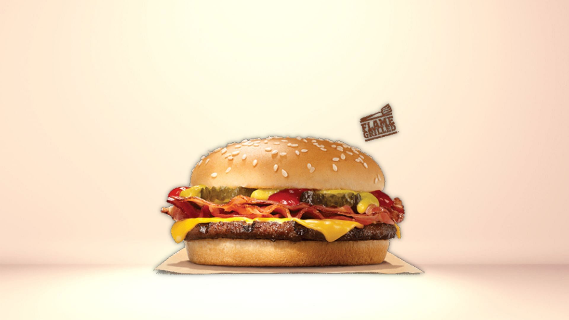 Burger King is offering customers one free bacon cheeseburger as part of its end-of-the-year freebies (Image via Burger King)