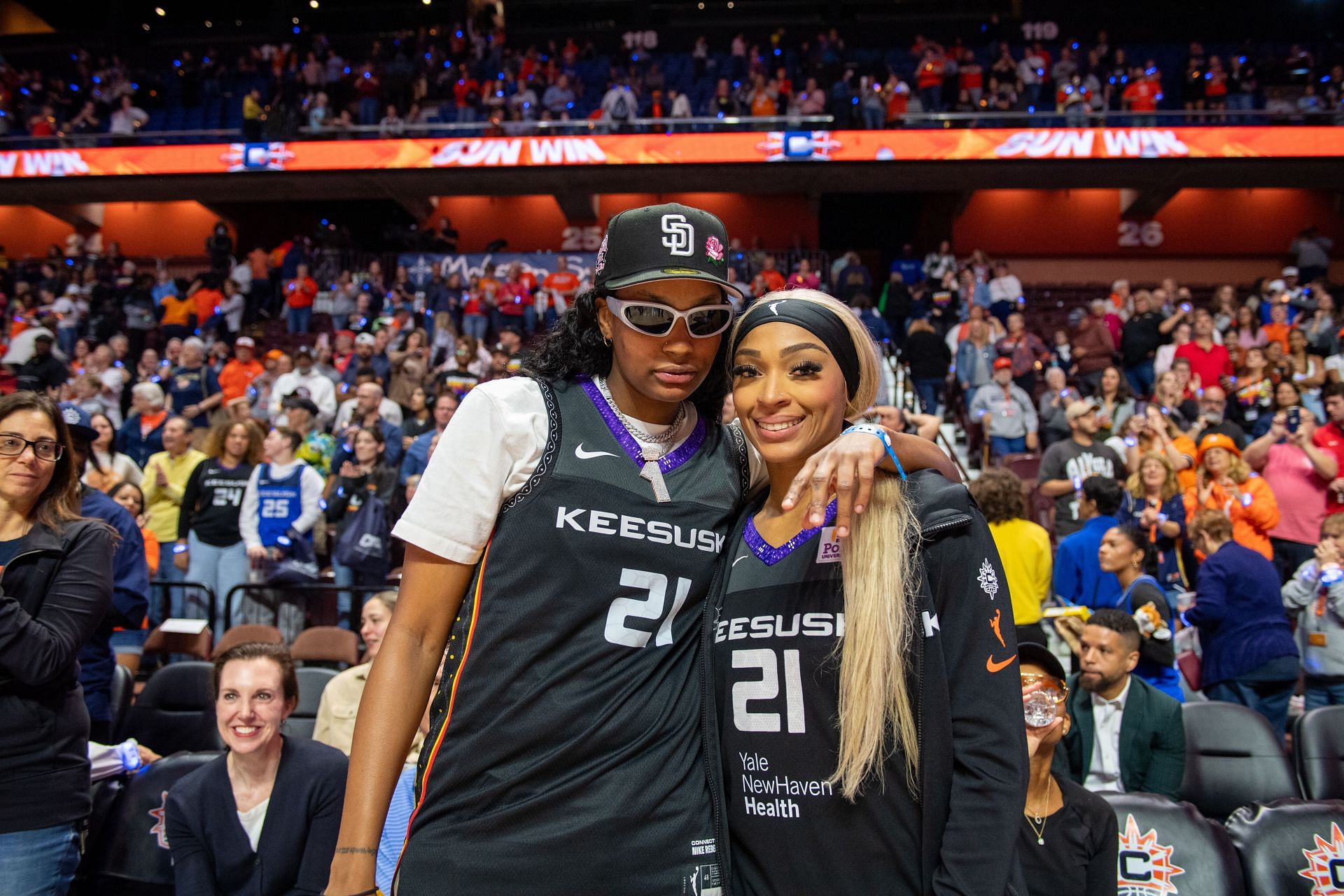 Indiana Fever forward NaLyssa Smith (left) and Connecticut Sun guard/forward DiJonai Carrington (right) pose for a photo during the Semifinals of the WNBA Playoffs on October 6, 2024. (Source : Getty)