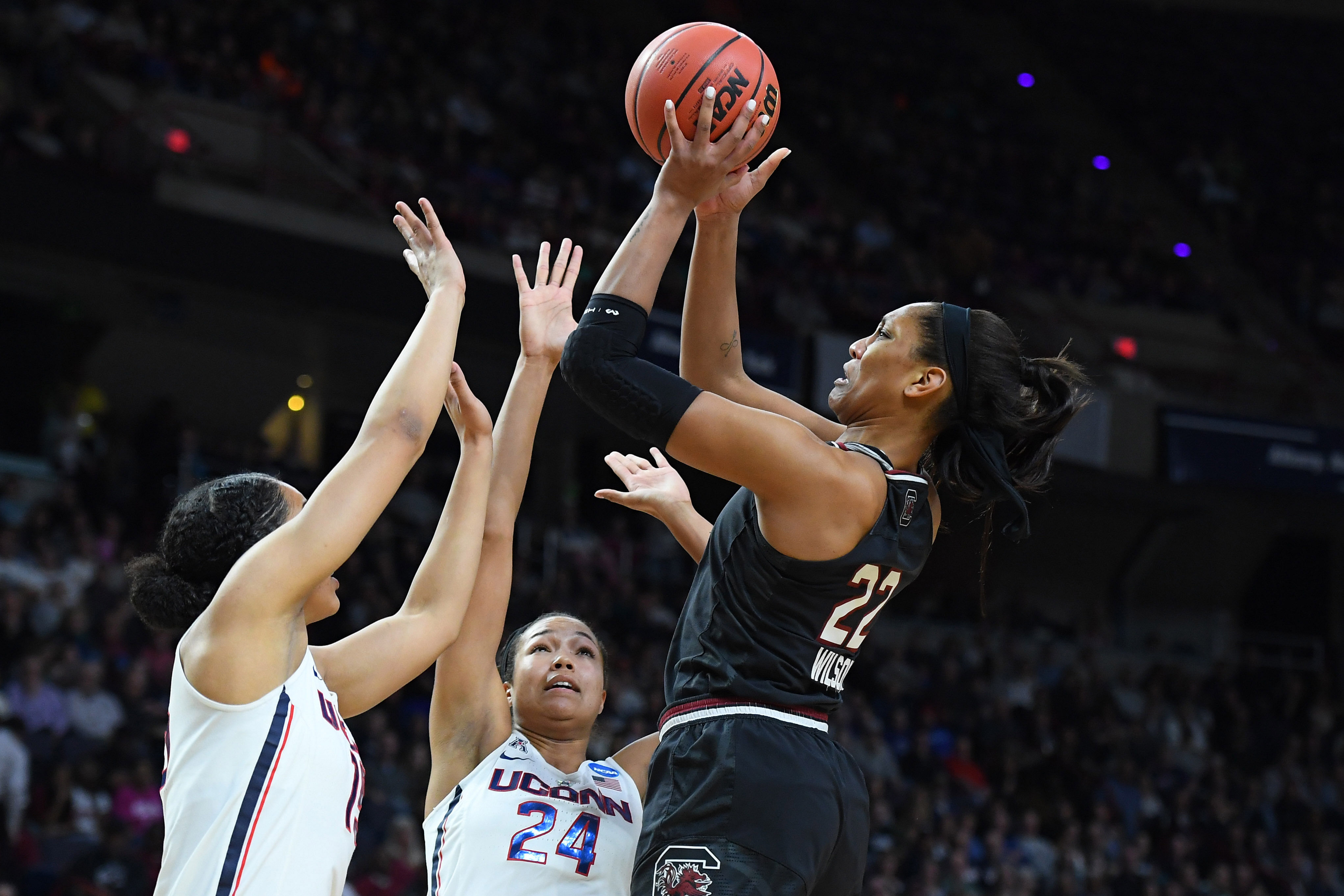 South Carolina Gamecocks forward A&#039;ja Wilson shoots over UConn Huskies forward Napheesa Collier (24) and forward Gabby Williams during their NCAA game in 2018. Photo: Imagn