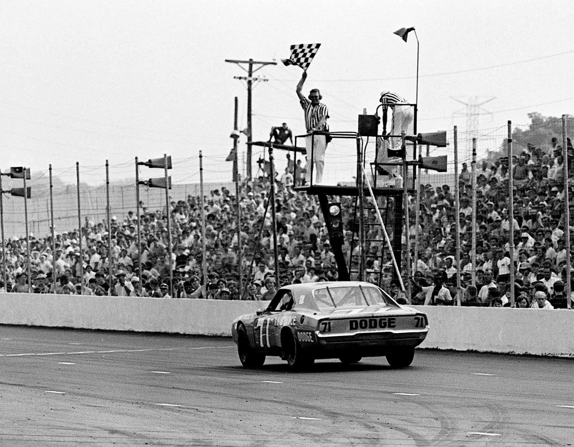 Bobby Isaac (71) takes the checkered flag to win the Nashville 420 NASCAR race - Source: Imagn